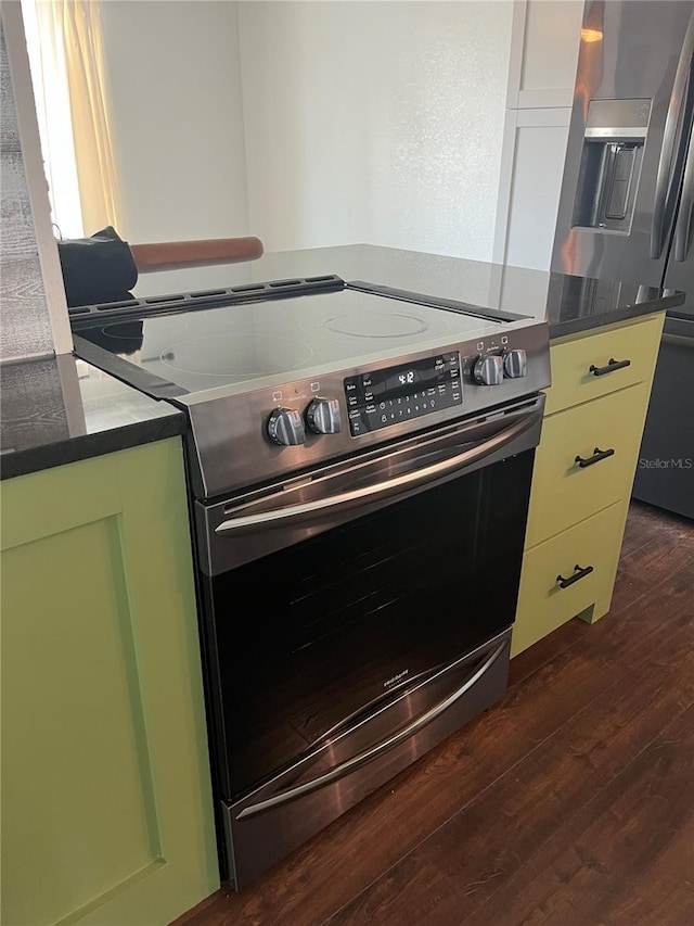 821 Silver Springs Ter NW, Port Charlotte, FL 33948 - kitchen with stainless steel appliances, dark wood-type flooring, and dark countertops
