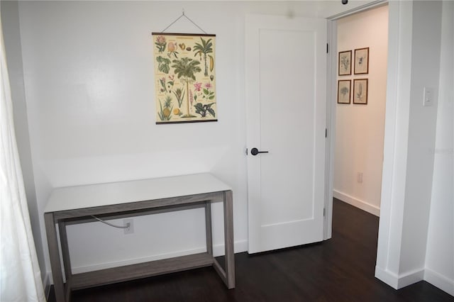 821 Silver Springs Ter NW, Port Charlotte, FL 33948 - hallway with dark wood-style floors and baseboards
