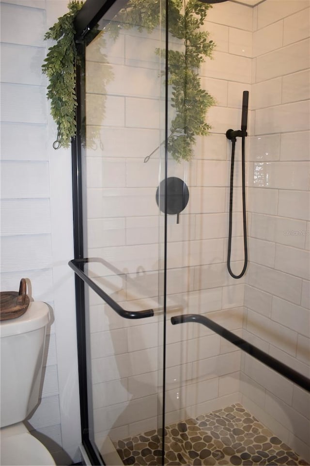 821 Silver Springs Ter NW, Port Charlotte, FL 33948 - full bathroom featuring a stall shower and toilet
