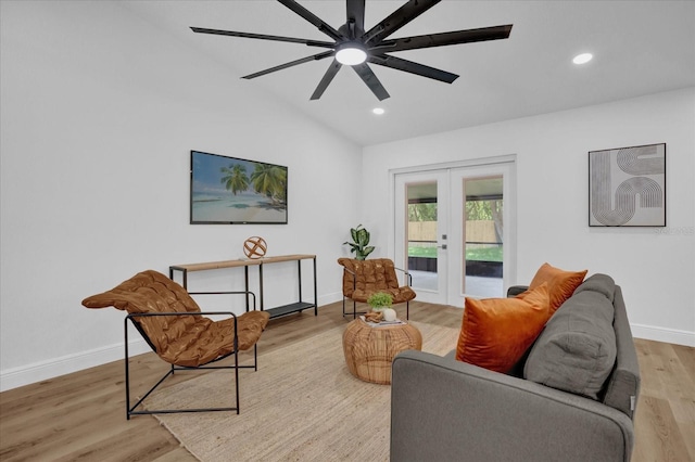 living room featuring lofted ceiling, french doors, baseboards, a ceiling fan, and light wood-style floors