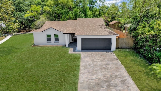 view of front facade with stucco siding, an attached garage, decorative driveway, and a shingled roof