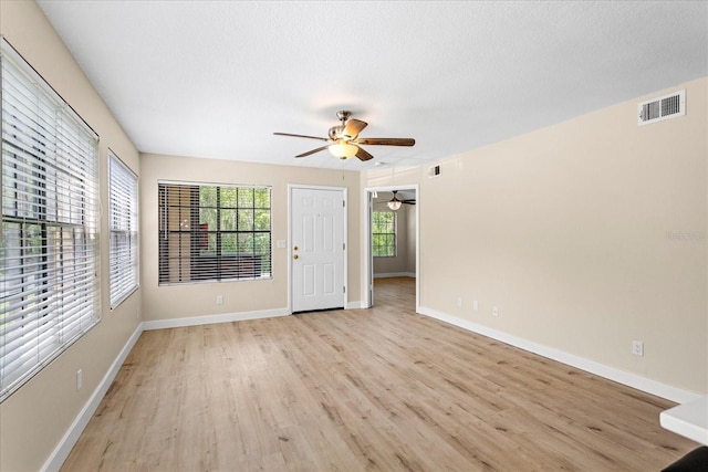 325 Forestway Cir Unit 104, Altamonte Springs, FL 32701 - empty room with a ceiling fan, light wood-type flooring, and baseboards