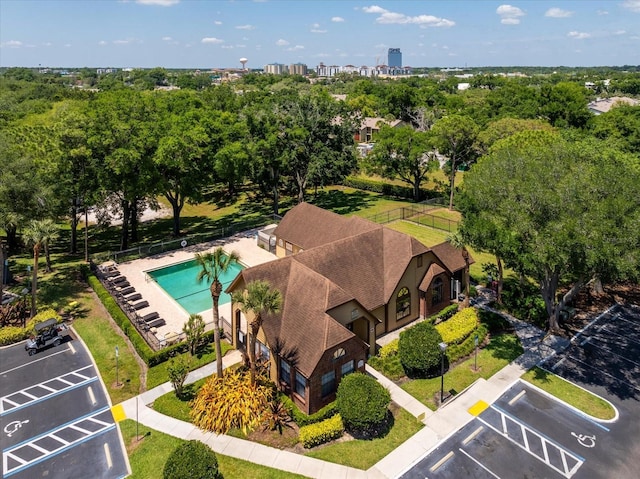 325 Forestway Cir Unit 104, Altamonte Springs, FL 32701 - view of urban area with a pool and a tree filled landscape