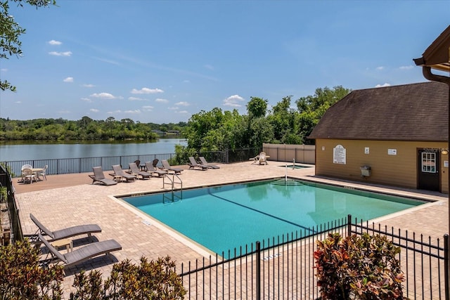 325 Forestway Cir Unit 104, Altamonte Springs, FL 32701 - community pool with a patio area, fence, a water view, and view of scattered trees