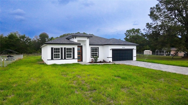 view of front of house featuring stucco siding, a garage, decorative driveway, and a shingled roof