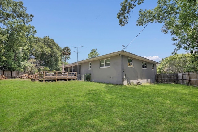 300 Hickory Ct, Apopka, FL 32712 - back of house featuring stucco siding and a wooden deck