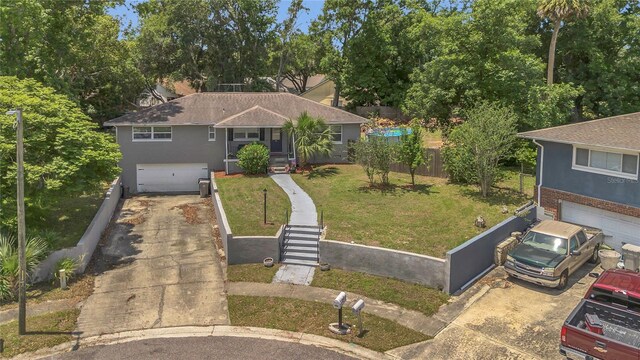 300 Hickory Ct, Apopka, FL 32712 - ranch-style house with a garage, driveway, a front lawn, and stucco siding