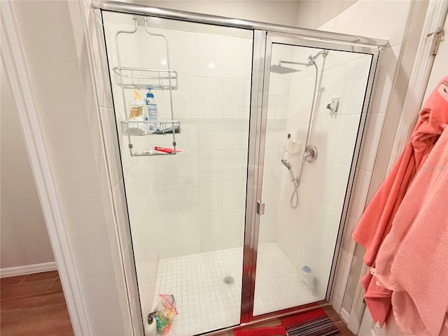 full bath with a shower stall