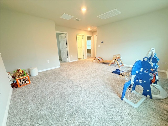 rec room featuring carpet flooring and baseboards