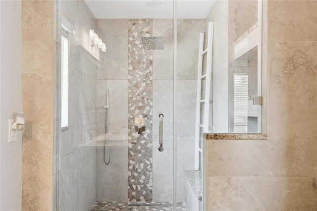 full bath featuring a shower stall