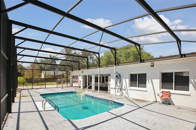 swimming pool with a patio and a lanai