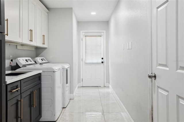 949 Shadow Oaks Rd, Kissimmee, FL 34744 - laundry area with washer and clothes dryer and cabinet space