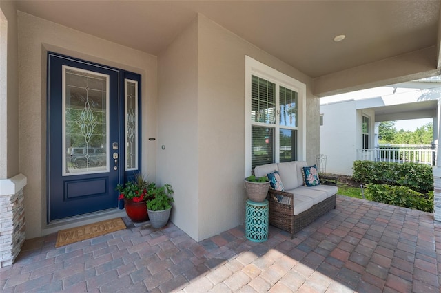 15420 Southern Martin St, Winter Garden, FL 34787 - property entrance with stucco siding and covered porch