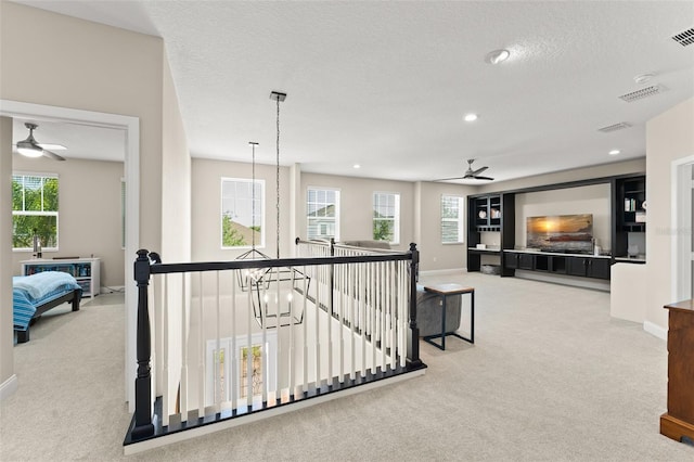 15420 Southern Martin St, Winter Garden, FL 34787 - corridor with an upstairs landing, carpet flooring, baseboards, recessed lighting, and a textured ceiling