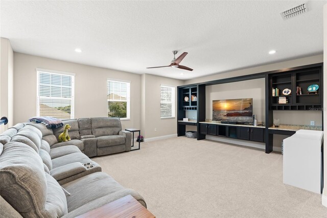 15420 Southern Martin St, Winter Garden, FL 34787 - living room with ceiling fan, light carpet, recessed lighting, a textured ceiling, and baseboards