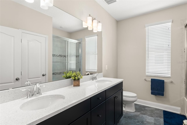 15420 Southern Martin St, Winter Garden, FL 34787 - full bath featuring a tile shower, double vanity, baseboards, and toilet