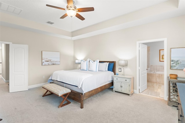 15420 Southern Martin St, Winter Garden, FL 34787 - bedroom with light colored carpet, baseboards, ensuite bath, and ceiling fan
