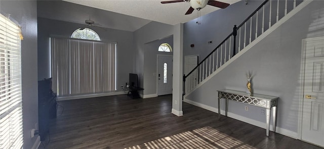 8612 Valley Ridge Ct, Orlando, FL 32818 - entrance foyer featuring ceiling fan, healthy amount of natural light, stairway, and vaulted ceiling