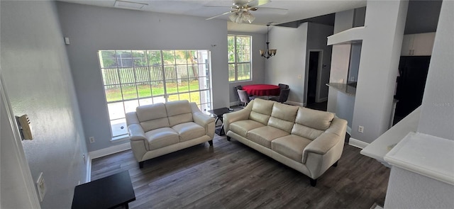 8612 Valley Ridge Ct, Orlando, FL 32818 - living room featuring baseboards, a ceiling fan, and dark wood finished floors