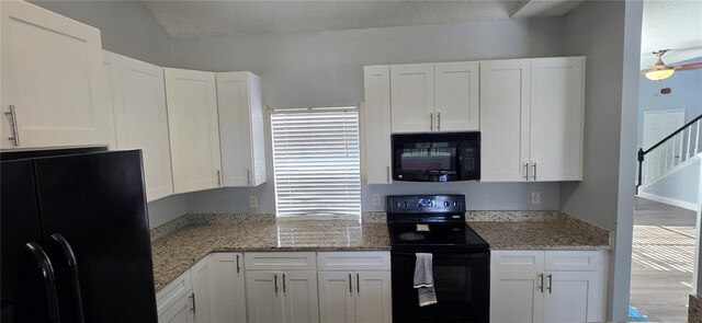 8612 Valley Ridge Ct, Orlando, FL 32818 - kitchen with black appliances, white cabinetry, and light stone countertops