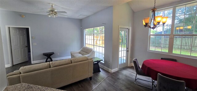 8612 Valley Ridge Ct, Orlando, FL 32818 - living area featuring healthy amount of natural light, dark wood finished floors, a ceiling fan, a chandelier, and a textured ceiling
