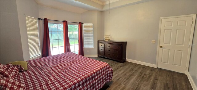 8612 Valley Ridge Ct, Orlando, FL 32818 - bedroom featuring wood finished floors, baseboards, crown molding, and a raised ceiling