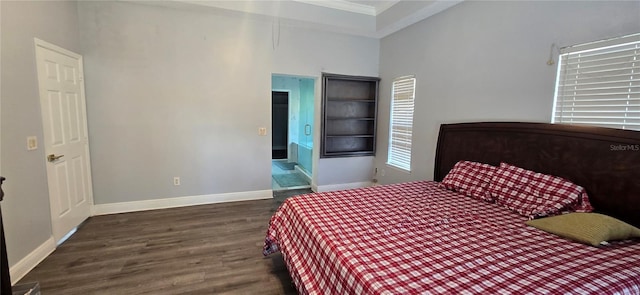 8612 Valley Ridge Ct, Orlando, FL 32818 - bedroom featuring wood finished floors, crown molding, and baseboards