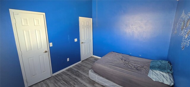 8612 Valley Ridge Ct, Orlando, FL 32818 - bedroom featuring wood finished floors and baseboards