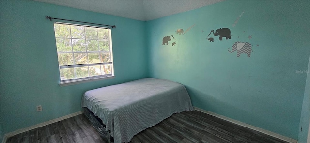 8612 Valley Ridge Ct, Orlando, FL 32818 - bedroom with wood finished floors and baseboards
