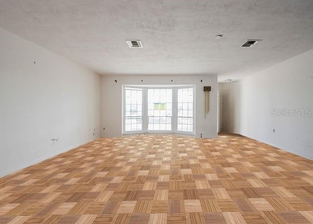 5500 Leeward Ln, New Port Richey, FL 34652 - spare room with a textured ceiling