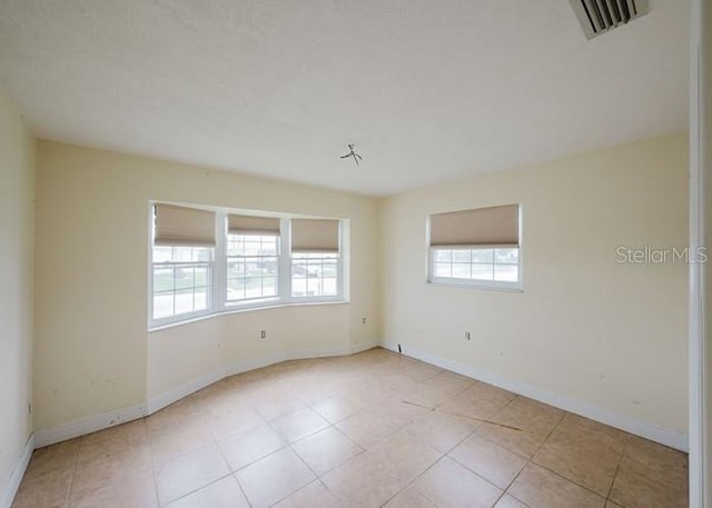 5500 Leeward Ln, New Port Richey, FL 34652 - unfurnished room featuring baseboards and tile patterned flooring