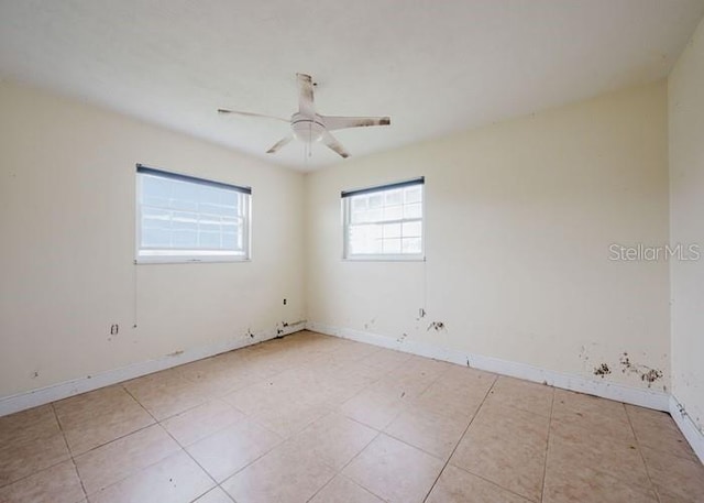 5500 Leeward Ln, New Port Richey, FL 34652 - empty room featuring light tile patterned floors and a ceiling fan