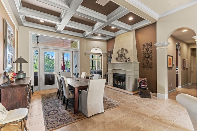 1070 Henley Downs Pl, Lake Mary, FL 32746 - dining area featuring arched walkways, coffered ceiling, beam ceiling, french doors, and a fireplace