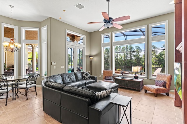 1070 Henley Downs Pl, Lake Mary, FL 32746 - living area with light tile patterned floors, a chandelier, a ceiling fan, and baseboards