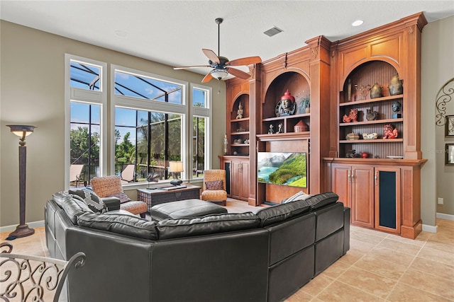 1070 Henley Downs Pl, Lake Mary, FL 32746 - living room featuring baseboards, ceiling fan, built in shelves, light tile patterned floors, and recessed lighting