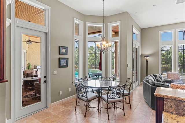 1070 Henley Downs Pl, Lake Mary, FL 32746 - dining area featuring baseboards, a chandelier, and light tile patterned floors