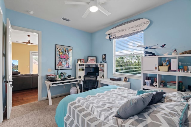 1070 Henley Downs Pl, Lake Mary, FL 32746 - bedroom featuring light carpet, multiple windows, and a ceiling fan