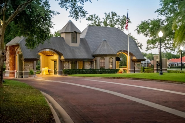 1070 Henley Downs Pl, Lake Mary, FL 32746 - french provincial home with stone siding, curved driveway, and stucco siding