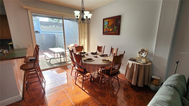 2157 Island Walk Dr, Orlando, FL 32824 - dining space with a chandelier and baseboards