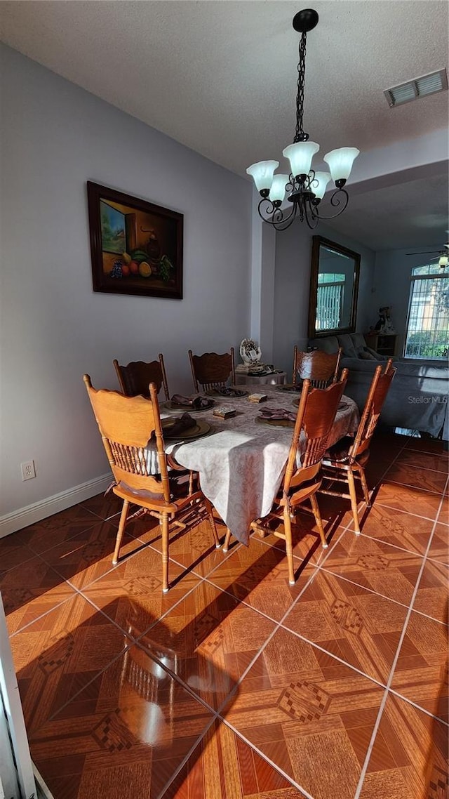 2157 Island Walk Dr, Orlando, FL 32824 - dining area with a chandelier and baseboards