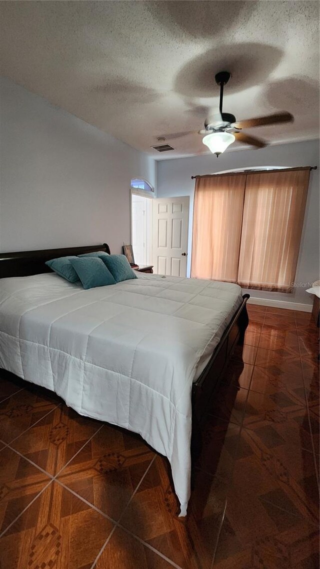 2157 Island Walk Dr, Orlando, FL 32824 - bedroom featuring a textured ceiling and ceiling fan