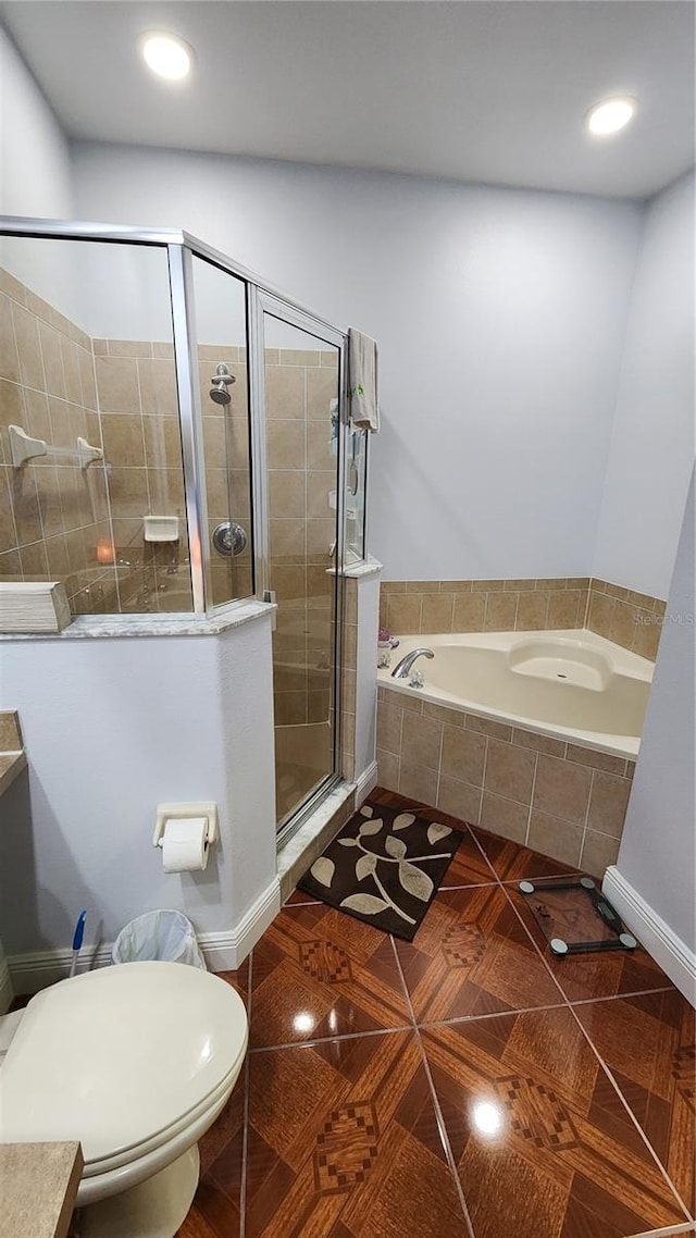 2157 Island Walk Dr, Orlando, FL 32824 - full bathroom with a stall shower, a garden tub, toilet, recessed lighting, and tile patterned floors