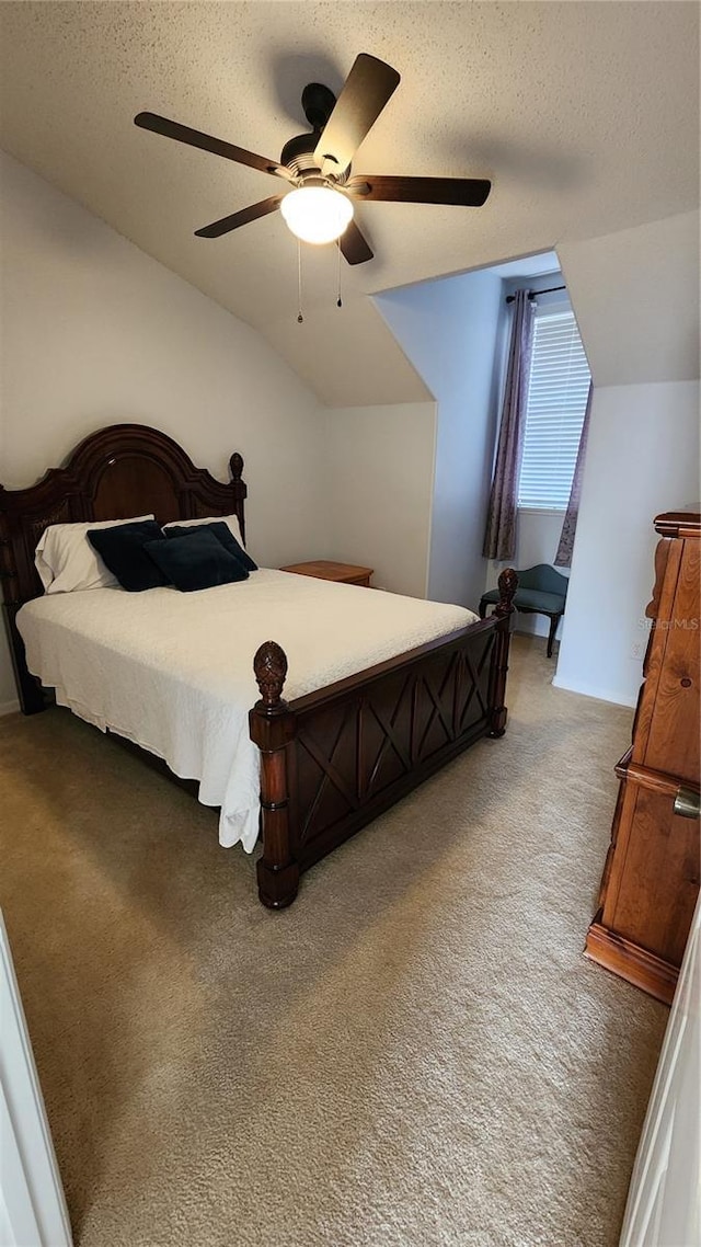 2157 Island Walk Dr, Orlando, FL 32824 - bedroom featuring lofted ceiling, light carpet, a textured ceiling, and ceiling fan