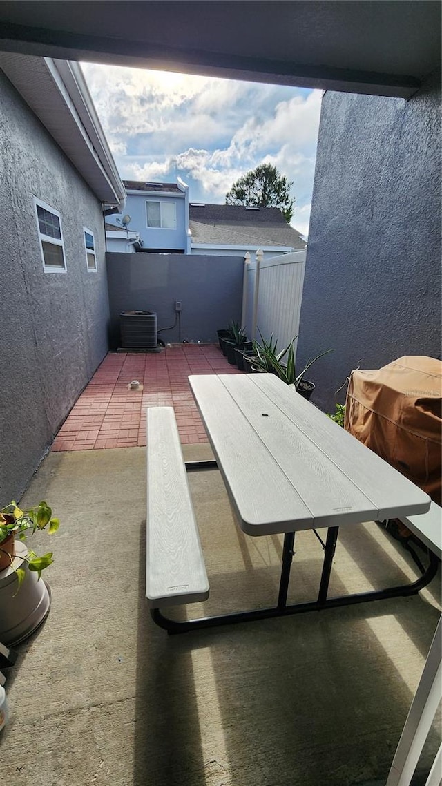 2157 Island Walk Dr, Orlando, FL 32824 - view of patio / terrace featuring fence and central AC unit
