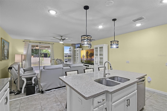 4051 Prairie Reserve Blvd, Orlando, FL 32824 - kitchen featuring a sink, ceiling fan, dishwasher, decorative light fixtures, and white cabinets