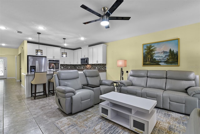 4051 Prairie Reserve Blvd, Orlando, FL 32824 - living area with a ceiling fan, recessed lighting, light tile patterned flooring, and baseboards