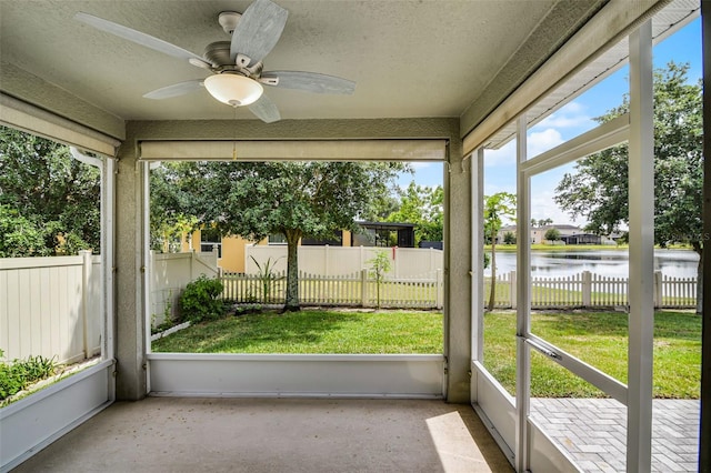 4051 Prairie Reserve Blvd, Orlando, FL 32824 - unfurnished sunroom with a water view and ceiling fan