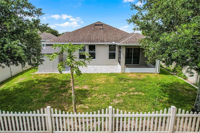 4051 Prairie Reserve Blvd, Orlando, FL 32824 - back of house with a sunroom, a shingled roof, and stucco siding