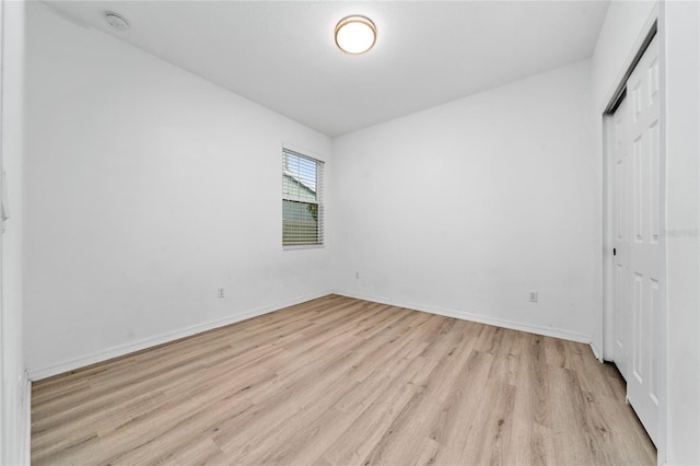 15862 Citrus Grove Loop, Winter Garden, FL 34787 - unfurnished bedroom featuring light wood-style floors, a closet, and baseboards