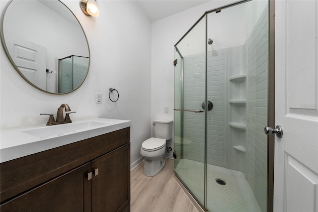 15862 Citrus Grove Loop, Winter Garden, FL 34787 - bathroom with toilet, wood finished floors, a stall shower, and vanity